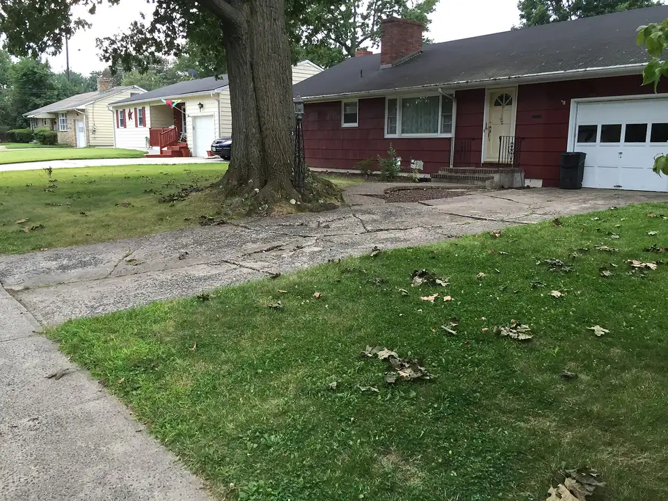 Driveway panels heaved and uneven at the joints